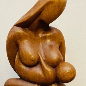 Motherhood-hand carved wood abstract sculpture-mother nursing her baby.